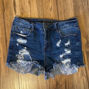 Distressed denim shorts